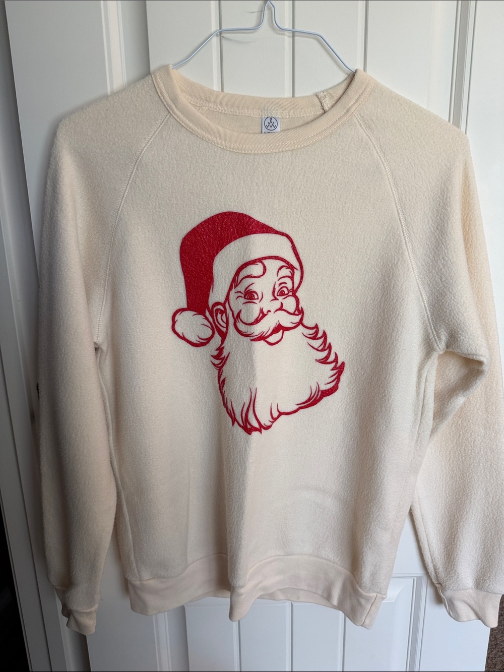 Alternative Cream Crewneck with Red Santa Graphic